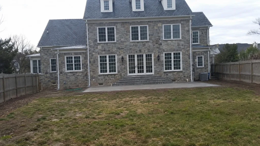 Fieldstone colonial, formal garden room — the original photo