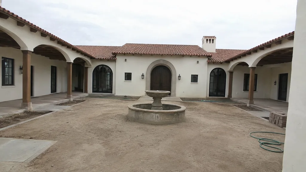 Hacienda courtyard, citrus urns — the original photo