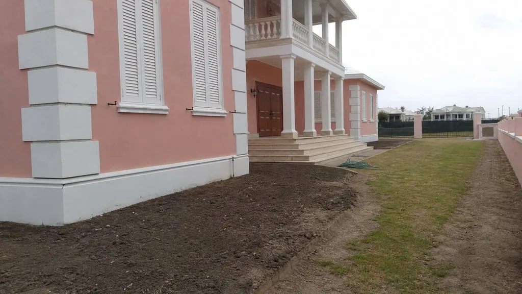 Island estate, tropical entry bed — the original photo