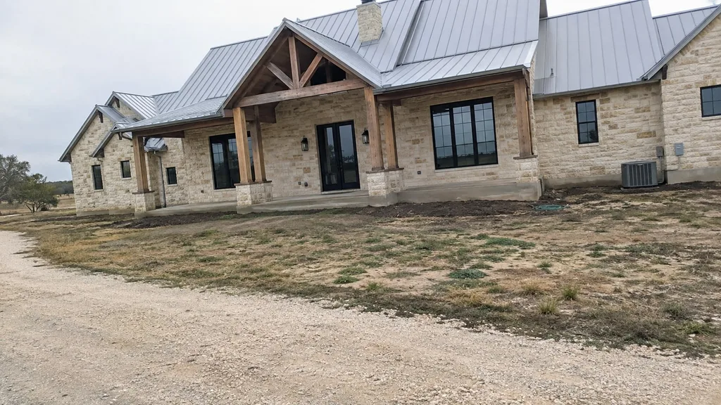 Limestone ranch house, prairie meadow — the original photo