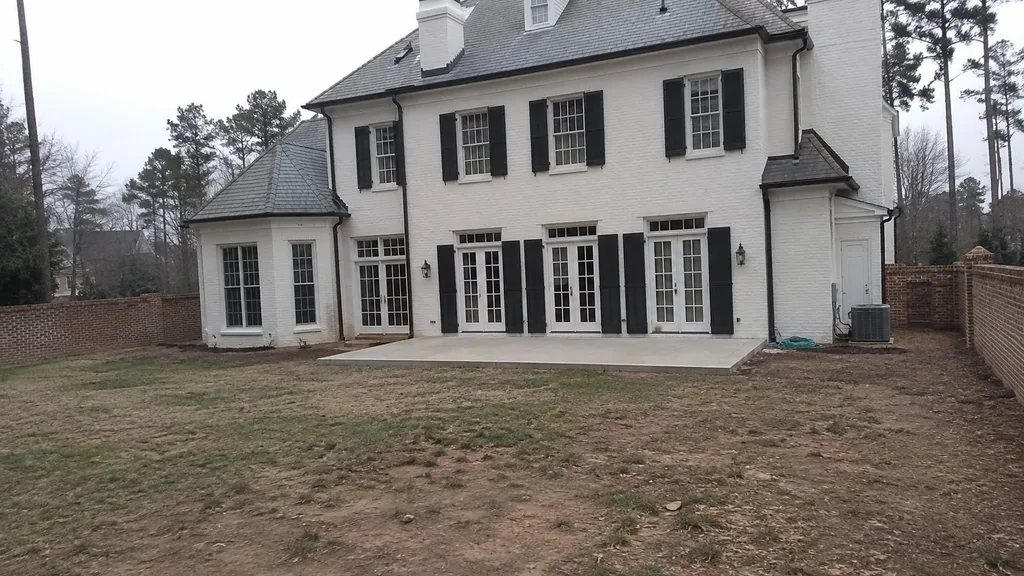 Painted-brick colonial, outdoor room — the original photo