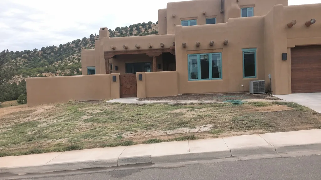 Santa Fe adobe, cold-hardy xeriscape — the original photo