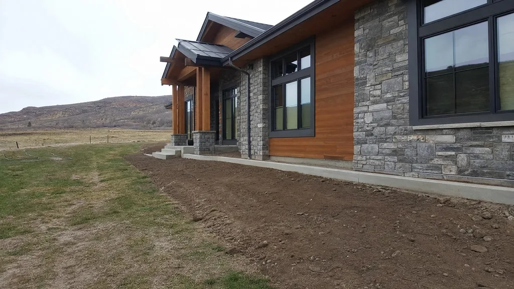Stone-and-timber contemporary, gravel xeriscape — the original photo