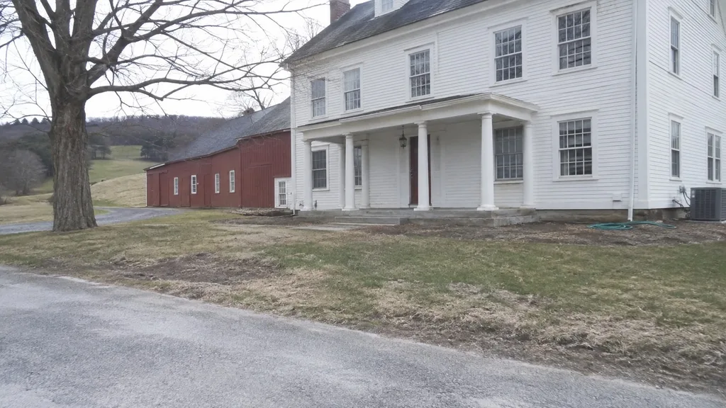 Vermont farmhouse, pollinator border — the original photo