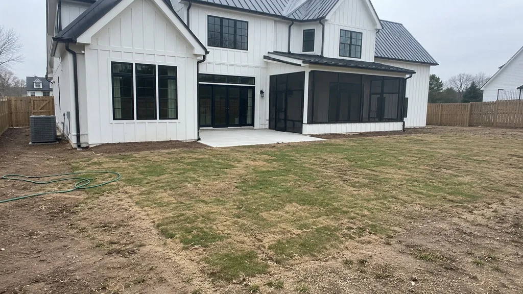 White farmhouse, gravel court — the original photo