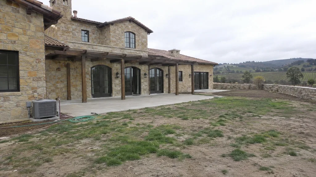 Wine-country stone villa, gravel garden — the original photo